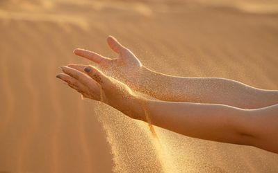 Close-up of a person's hands in a graceful, flowing motion.