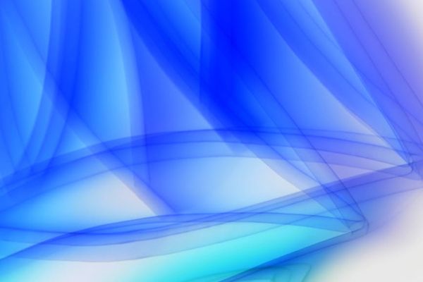 Person in a calm, flowing yoga movement against a light blue background.